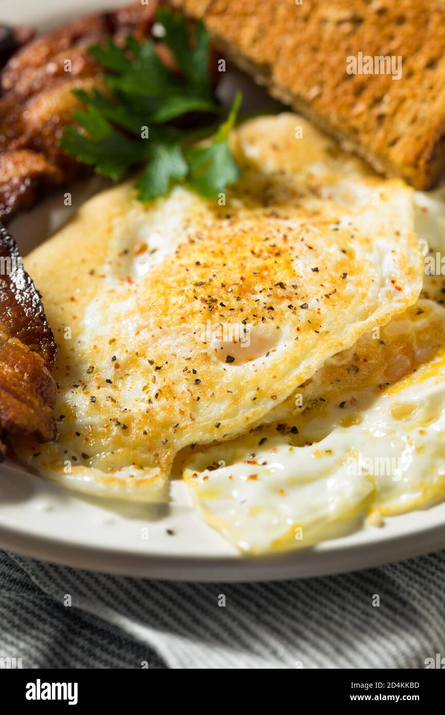 Homemade Over Easy Eggs With Bacon And Toast Stock Photo Alamy