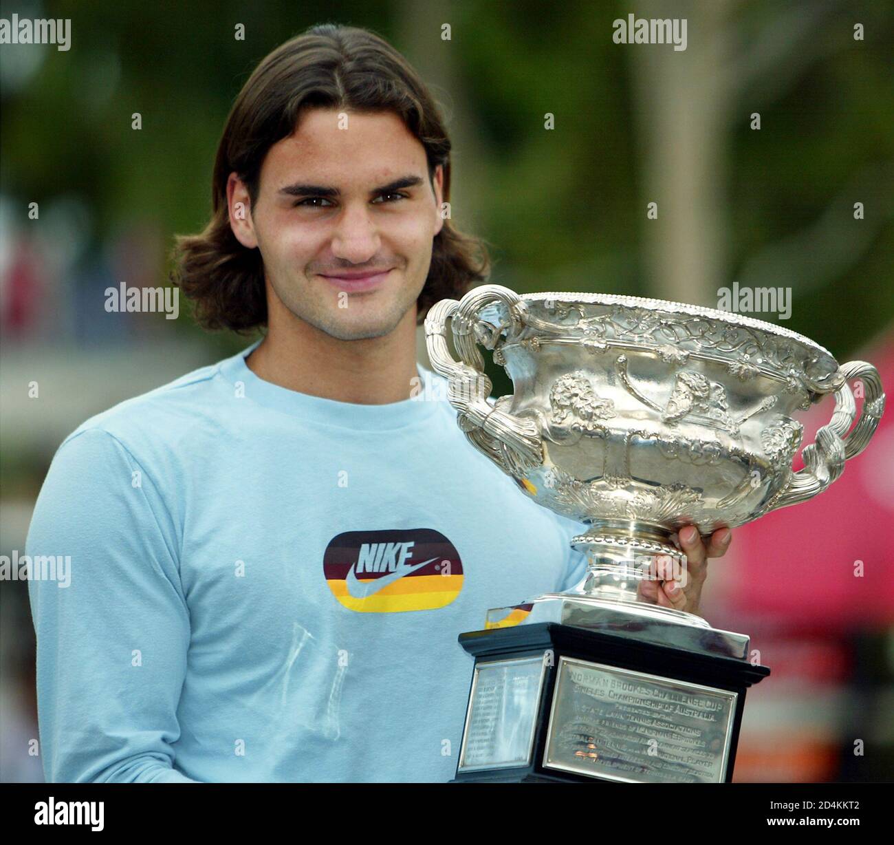 ROGER FEDERER OF SWITZERLAND POSES WITH THE TROPHY AFTER WINNING THE  AUSTRALIAN OPEN TENNIS CHAMPIONSHIP. Roger Federer of Switzerland poses for  photographers with the trophy after he beat Russia's Marat Safin in
