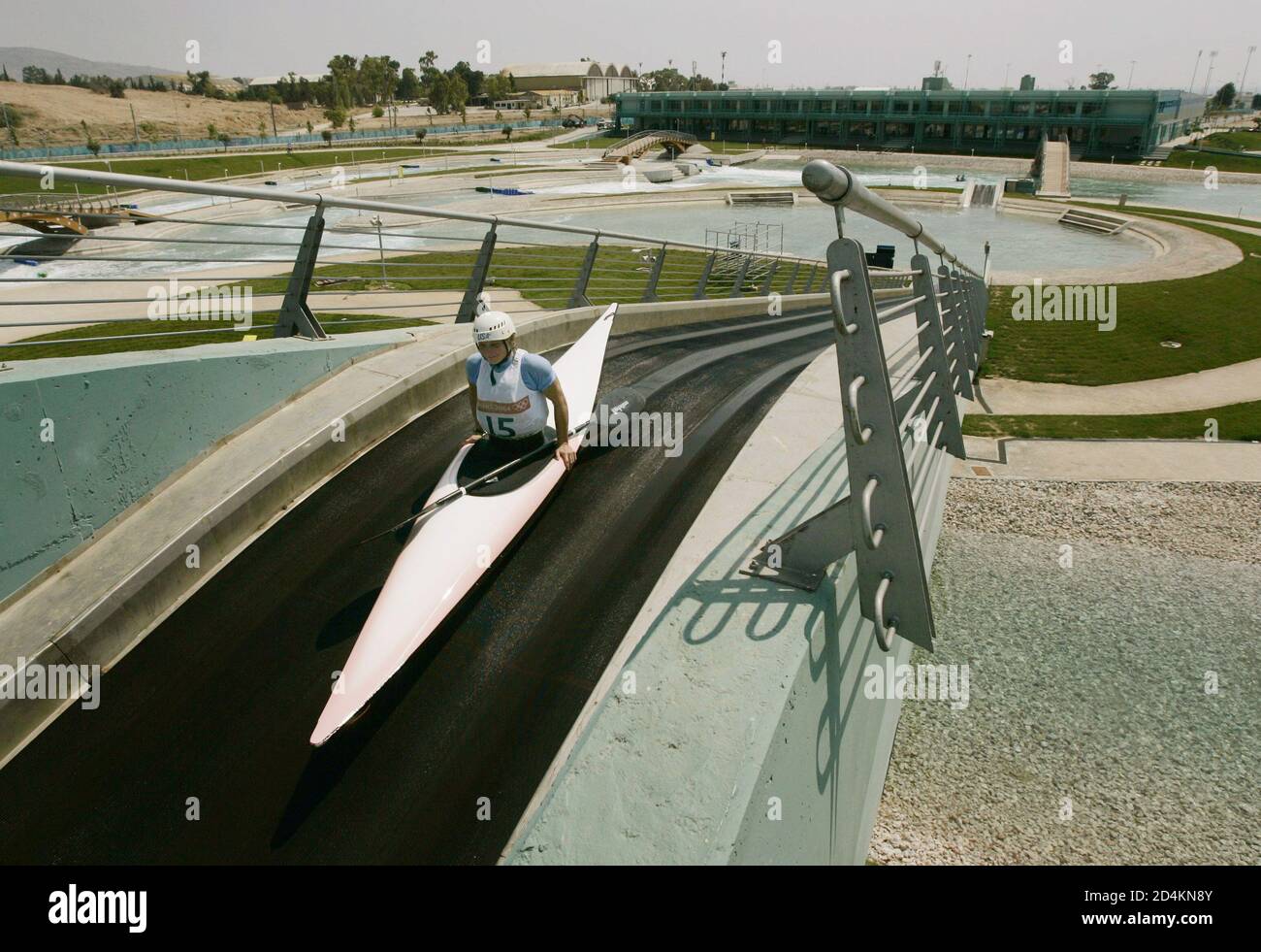 Rebecca Giddens Of The U S Rides A Giant Conveyor Belt To The Top Of The Course During Training For The Women S K1 Kayak Event At The Athens 04 Olympic Games August 12