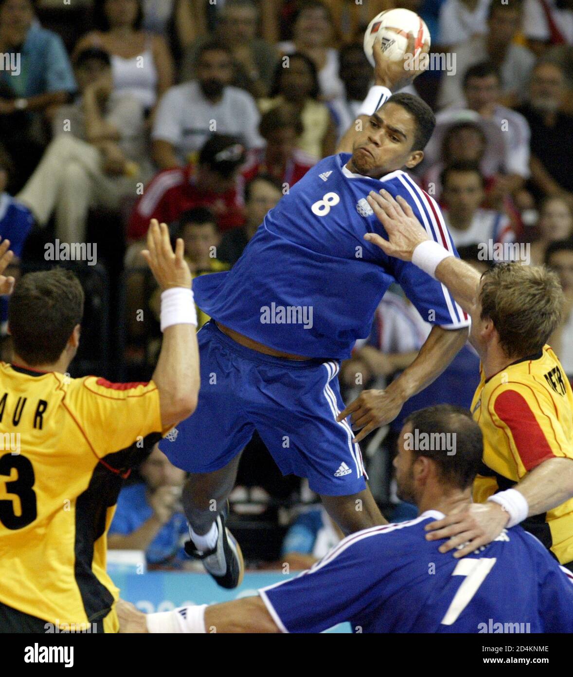 Germany S Christian Schwarzer And Florian Kehrmann Block France S Michael Guigou At Men S Handball Preliminaries At Athens 2004 Olympic Games Germany S Markus Baur L And Klaus Dieter Petersen Challenge France S Daniel Narcisse 2nd R
