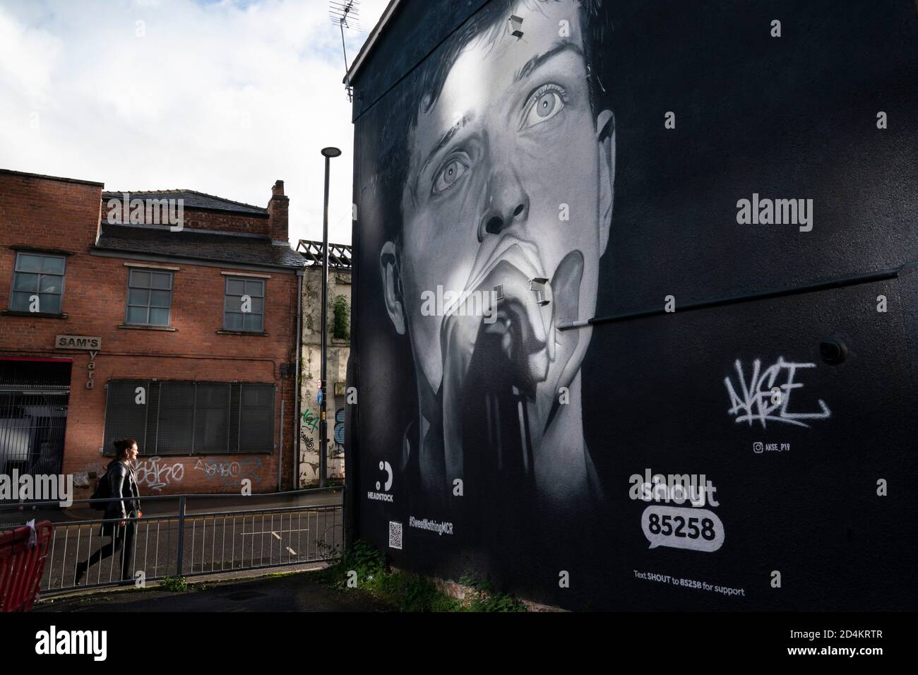 Manchester, UK. 9th October, 2020. A recently completed mural of former Joy Division singer Ian Curtis who died by suicide in 1980 and painted by street artist AkseP19 is seen in central Manchester ahead of  World Mental Health Day, Manchester, UK.  Credit: Jon Super/Alamy Live News. Stock Photo