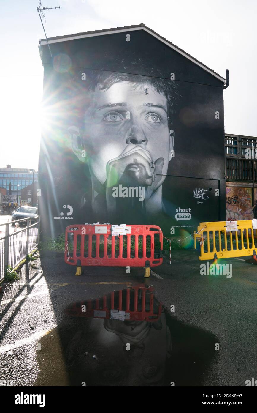 Manchester, UK. 9th October, 2020. A recently completed mural of former Joy Division singer Ian Curtis who died by suicide in 1980 and painted by street artist AkseP19 is seen in central Manchester ahead of  World Mental Health Day, Manchester, UK.  Credit: Jon Super/Alamy Live News. Stock Photo