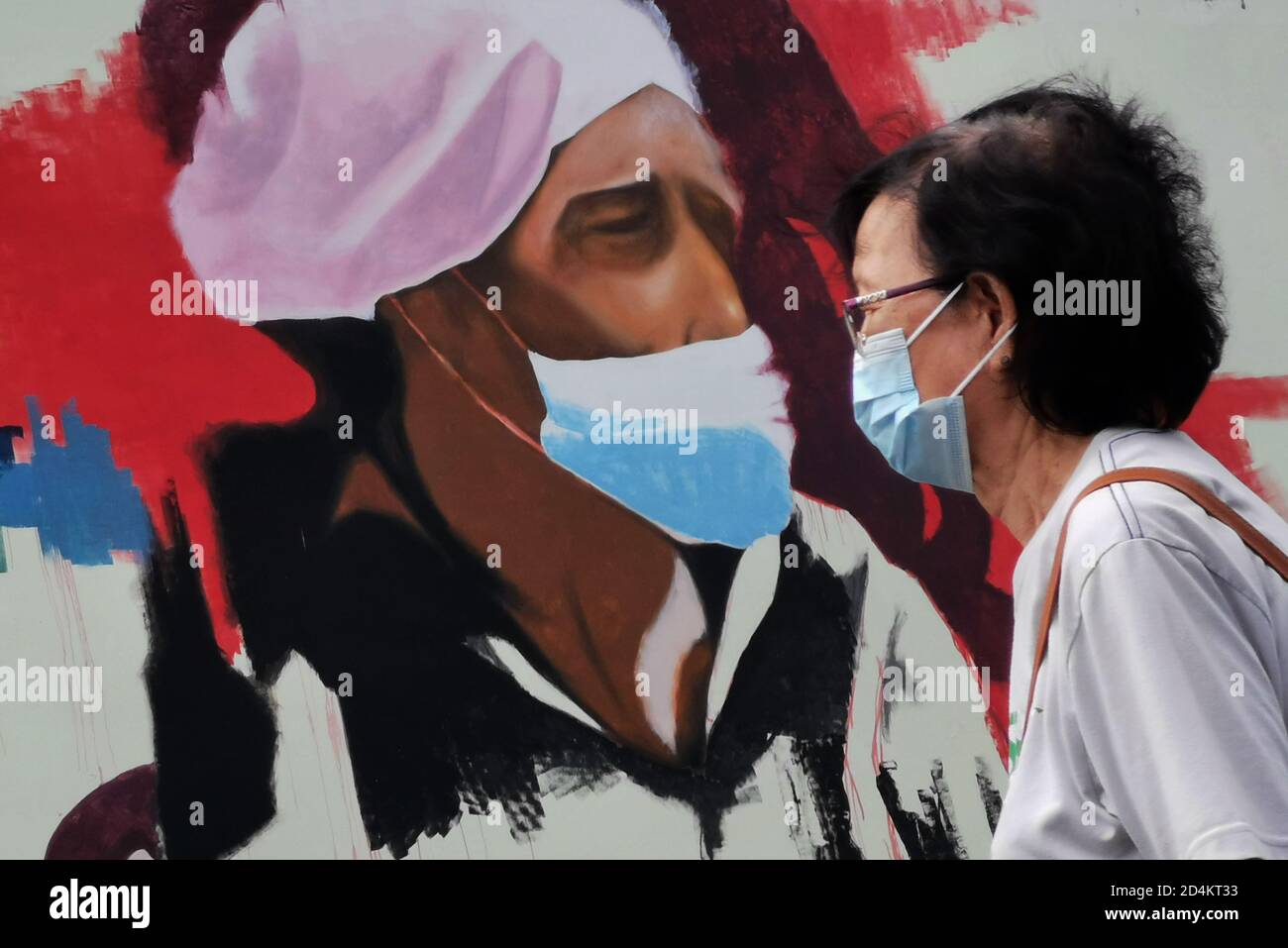 Kota Kinabalu 9th Oct A Woman Wearing A Mask Walks Past A Mural Reminding Of Keeping Social Distance In Kota Kinabalu Sabah Malaysia Oct 9 Malaysia Reported 354 New Covid 19
