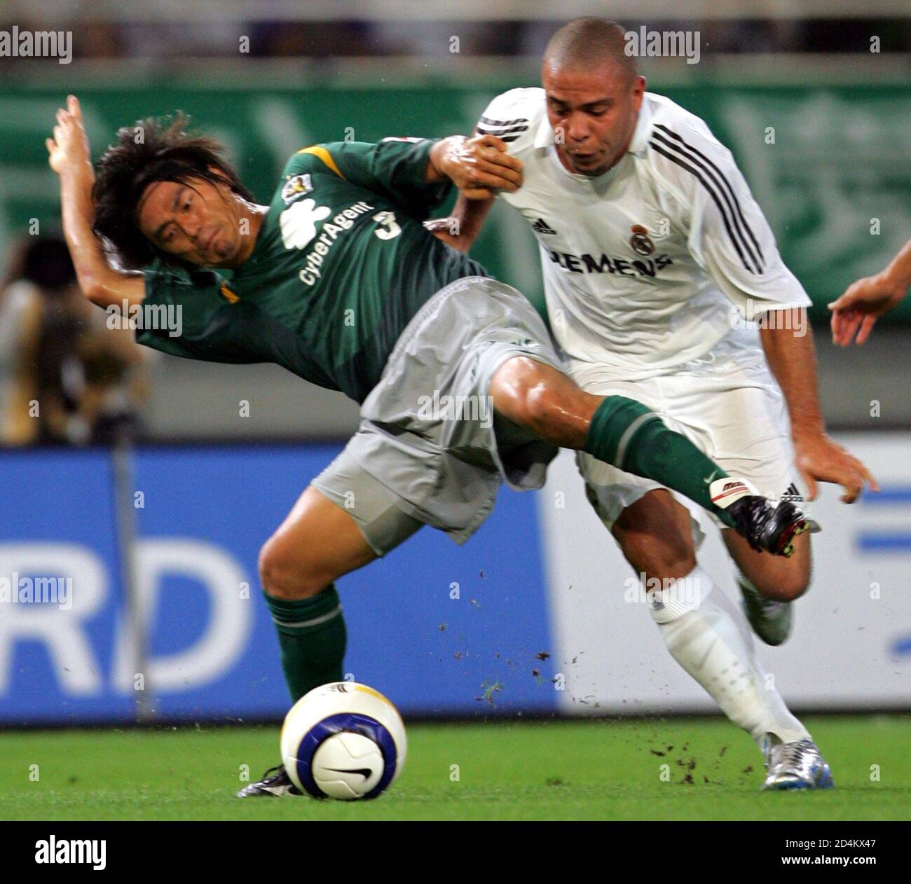 Real Madrid S Ronald Fights For The Ball With Tokyo Verdy S Togawa In Their International Friendly Match In Tokyo Real Madrid S Forward Ronaldo Of Brazil R Fights For The Ball With Tokyo Verdy S