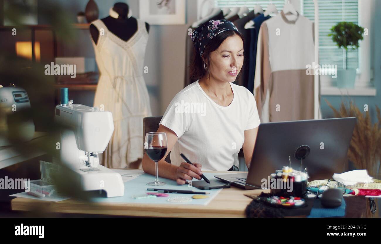 Designer creating sketch using laptop Stock Photo