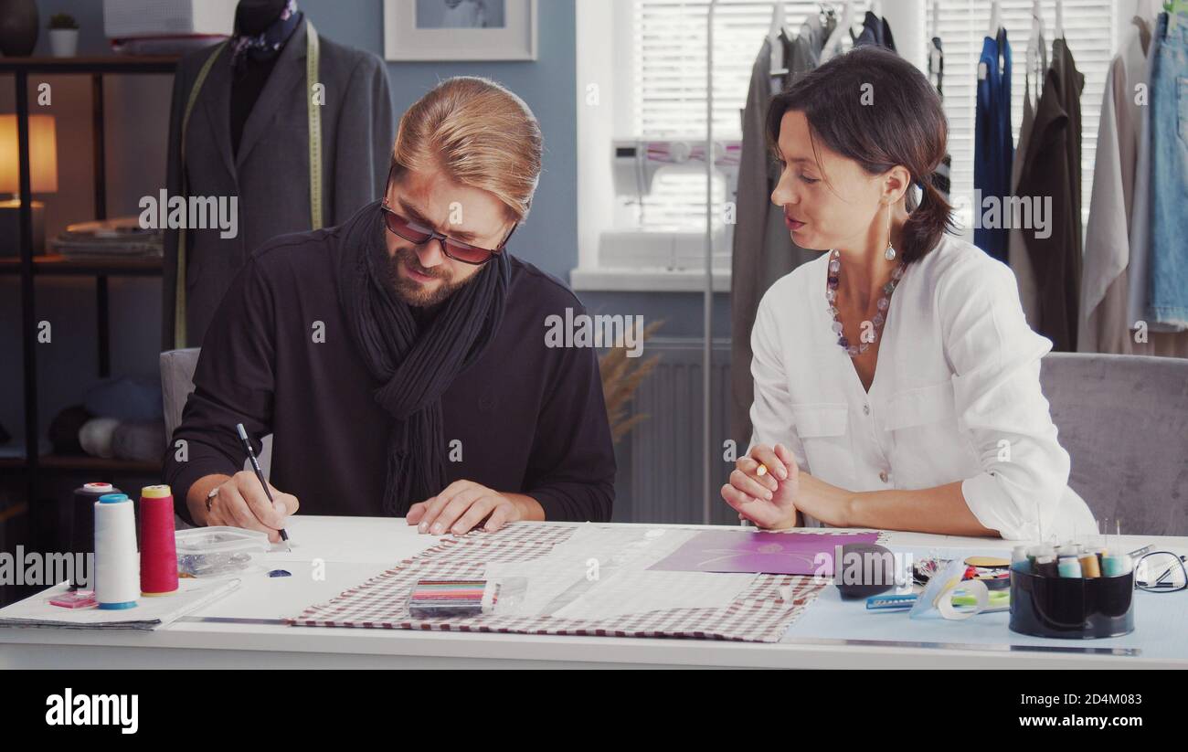 Two fashion designers drawing sketch Stock Photo