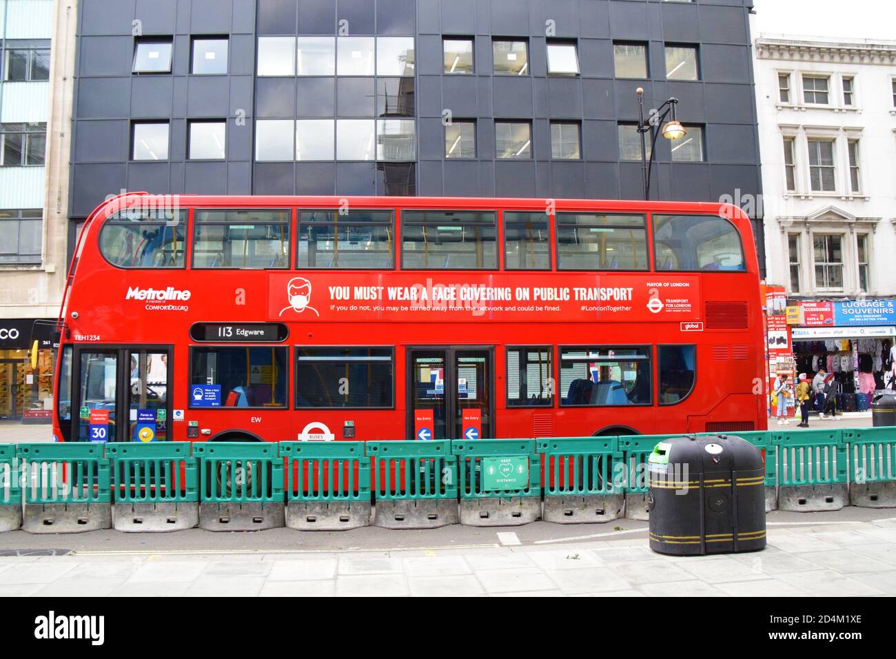Wear A Face Mask announcement on the side of a doubledecker bus