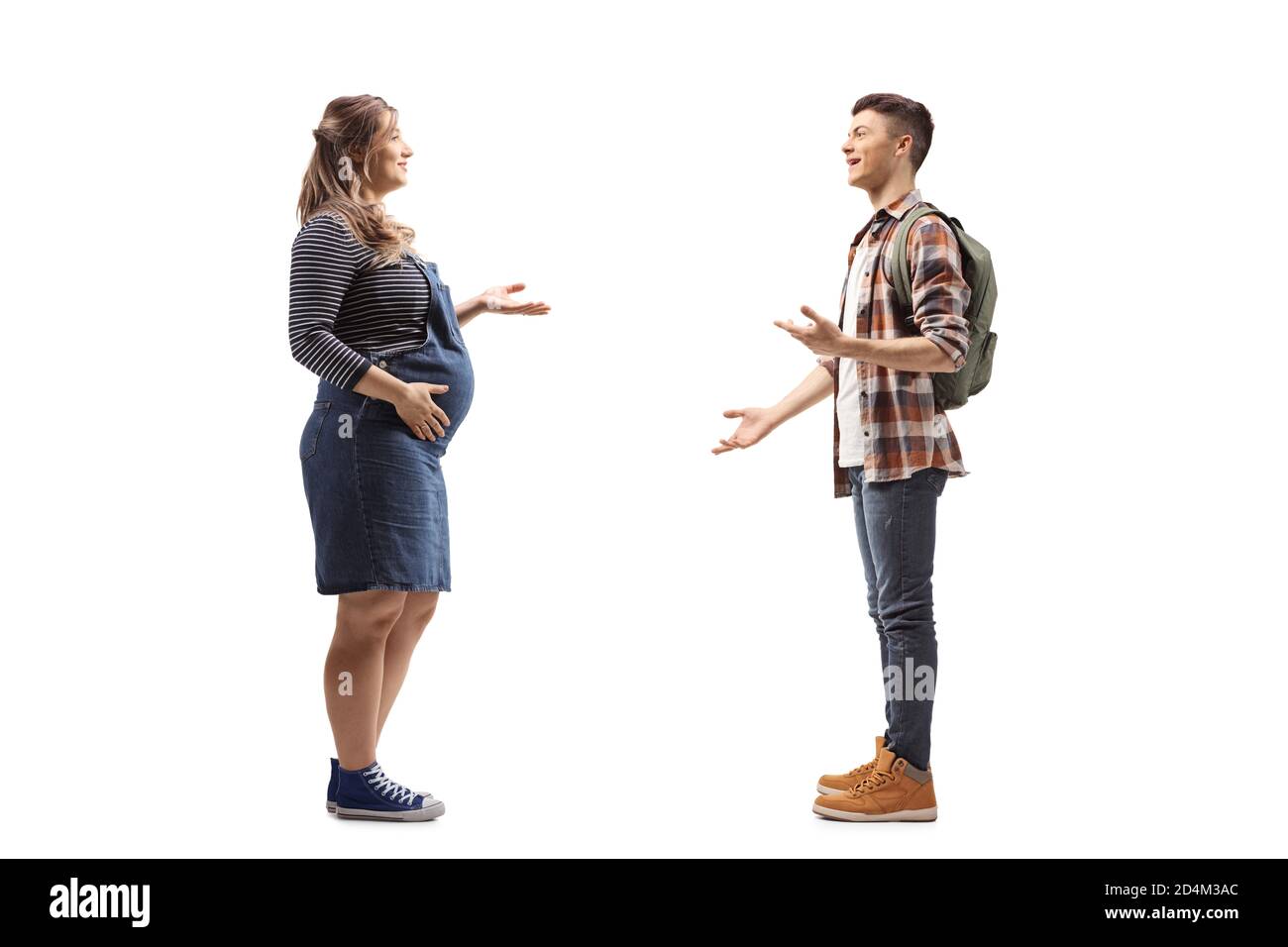 Full length profile shot of a pregnant woman talking to a male student with a backpack isolated on white background Stock Photo