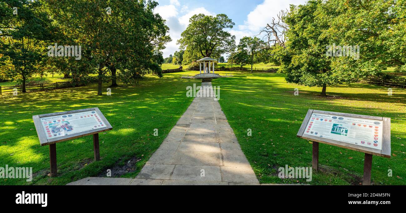 Panoramic of  the monument to the democratic legacy of the Magna Carta with information boards in foreground. Runnymede, Old Windsor, Surrey. Stock Photo