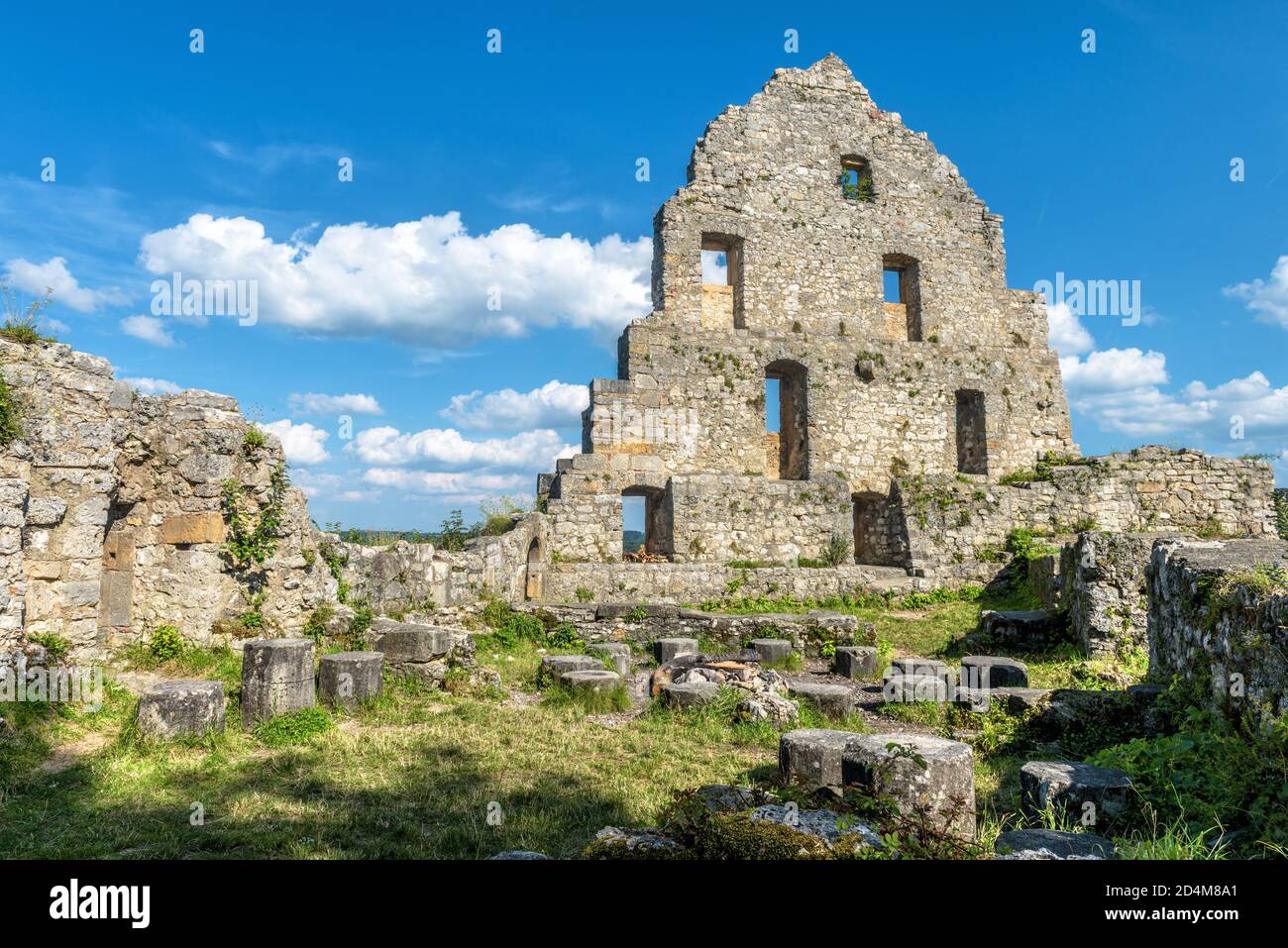 Ruins of Hohenurach Castle in countryside near old town of Bad Urach, Germany. Landscape with abandoned German castle in Swabian Alps in summer. This Stock Photo