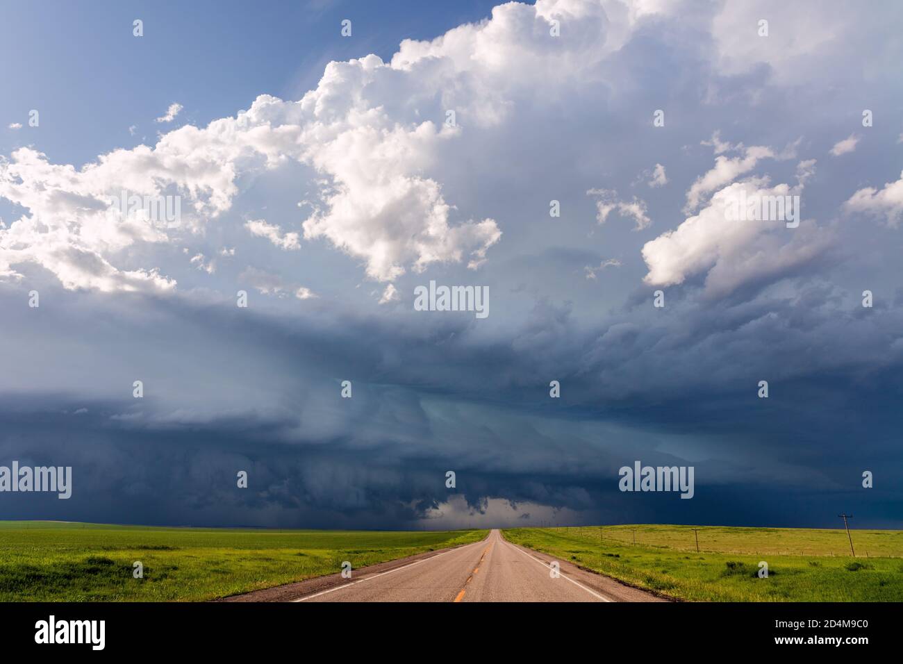 Scenic South Dakota landscape with a road and dark storm clouds approaching over the plains near Philip Stock Photo