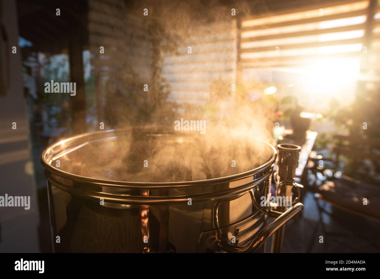 Most home brewers use brewing machines to brew beer at home. Stock Photo