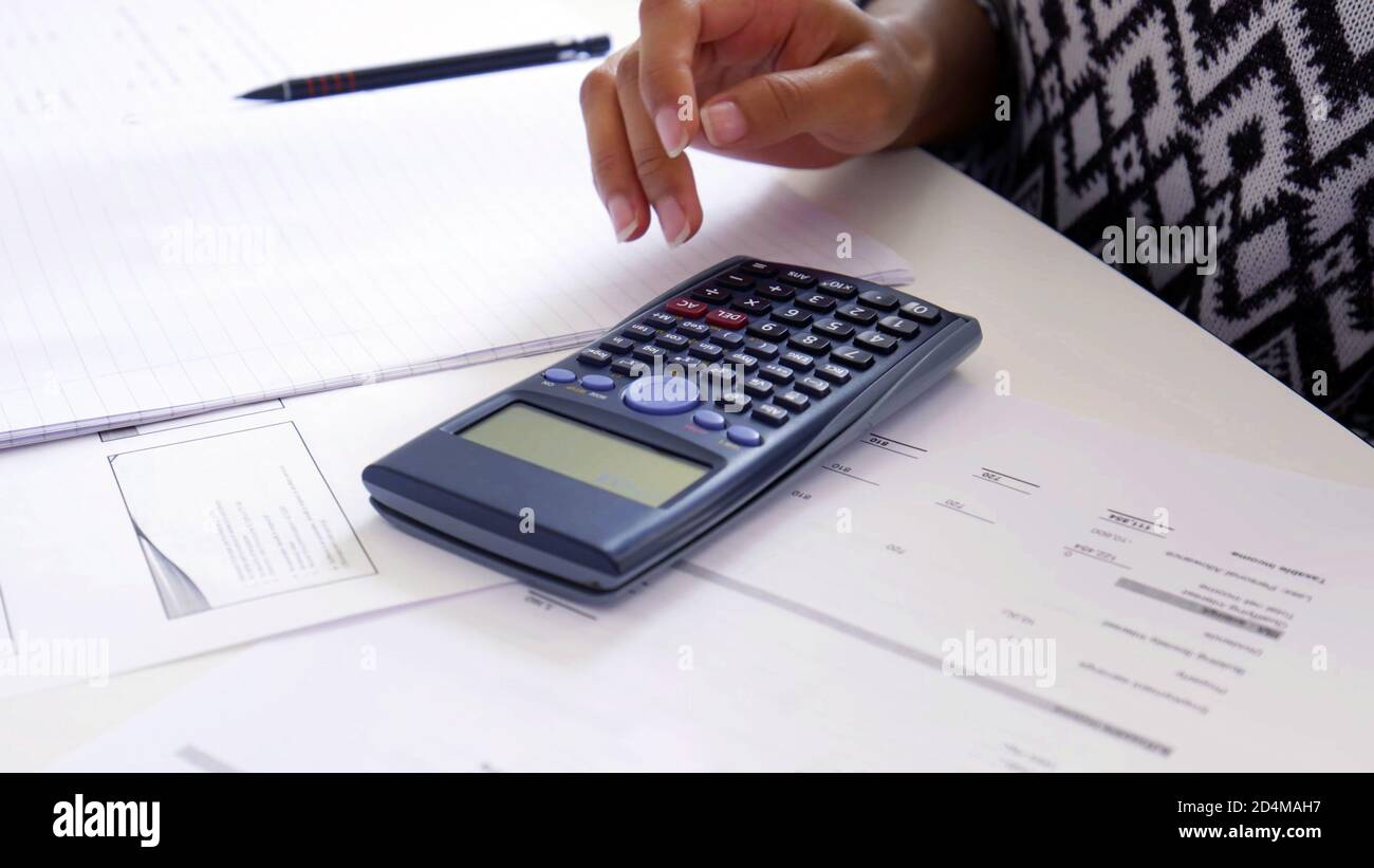 Women hand using a Scientific Calculator close up, exam preparation