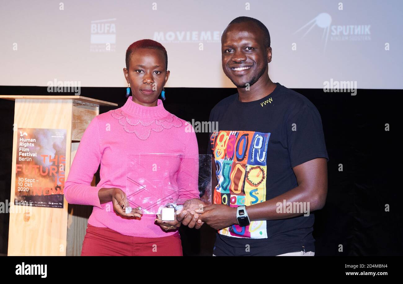 Berlin, Germany. 09th Oct, 2020. Njeri Mwangi (l), protagonist and Sam Solo, producer and screenwriter receive the Willy Brandt Documentary Award for her film 'Softie'. The Human Rights Film Festival, which took place for the third time in Berlin, was organized by the organizations Aktion gegen den Hunger, Save the Children and NRC Flüchtlingshilfe. Credit: Annette Riedl/dpa/Alamy Live News Stock Photo