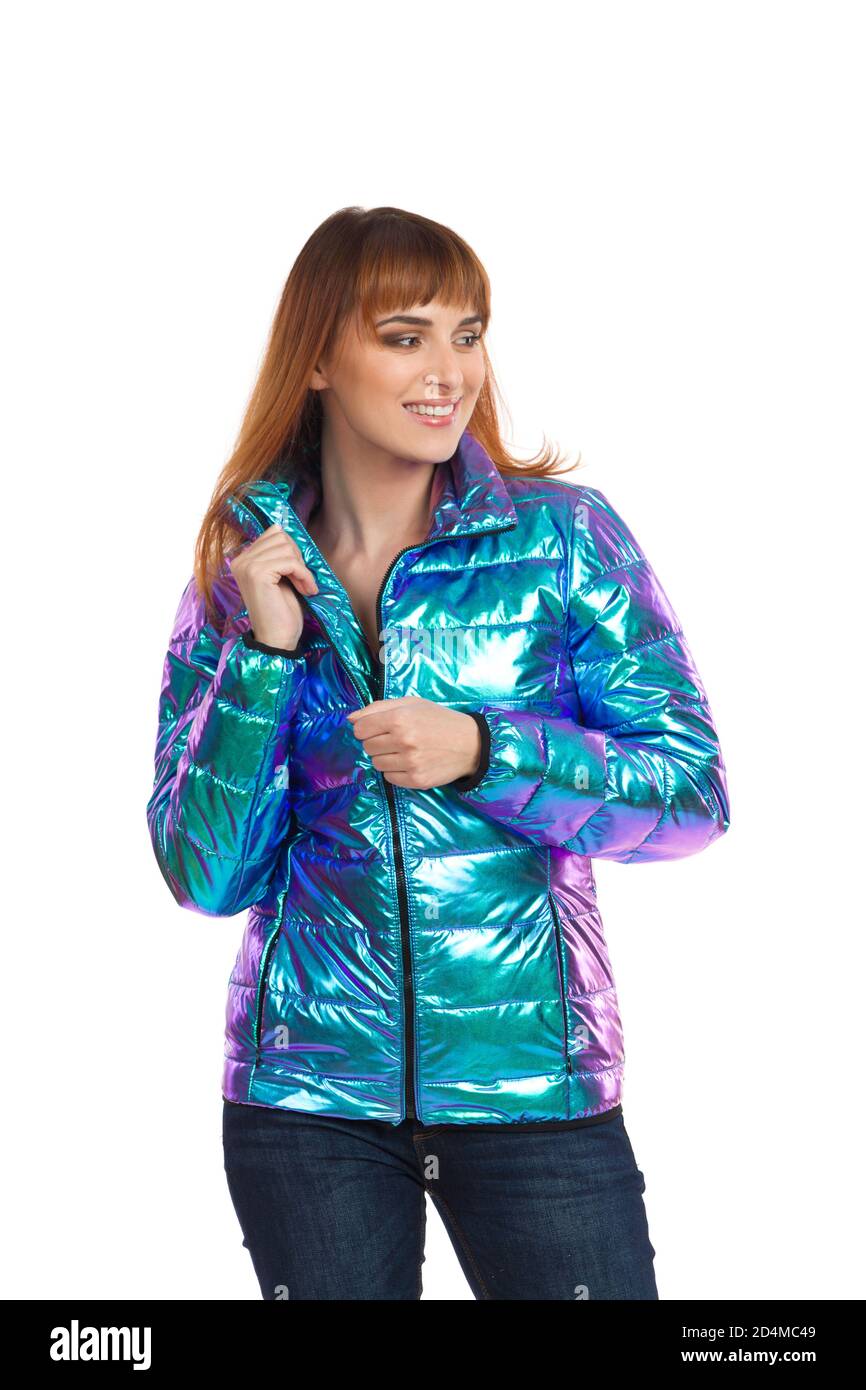 Young woman is posing in vibrant and shiny down jacket and holding  unbuttoned collar. Front view. Three quarter length studio shot isolated on  white Stock Photo - Alamy