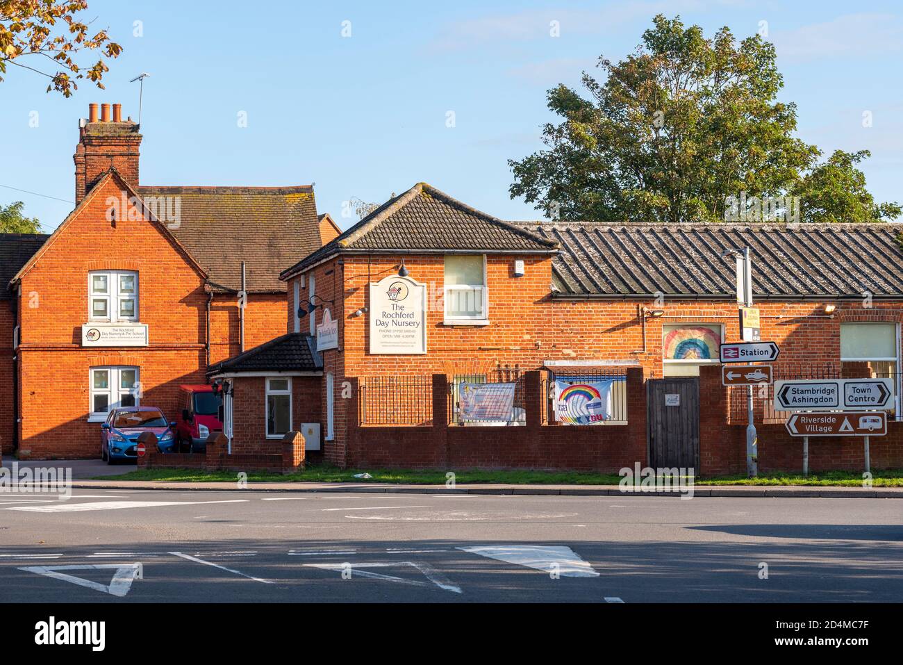 The Rochford Day Nursery, in Rochford, Southend, Essex, UK. During COVID-19 pandemic, with rainbow banner. Local traffic signs Stock Photo