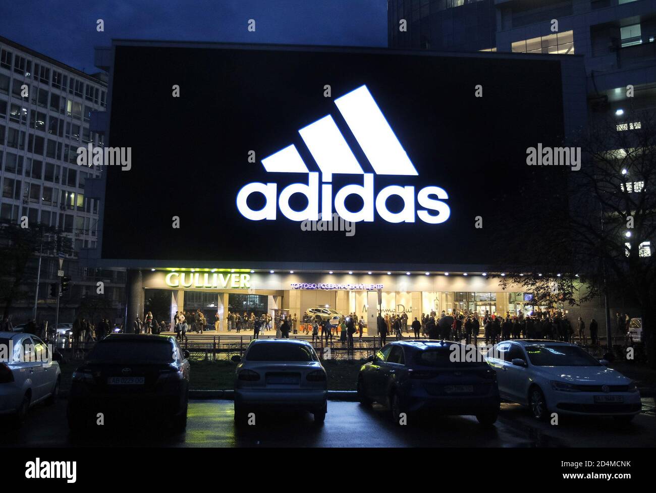 A huge screen shows the logo Adidas on a shopping mall building in downtown  Kiev Stock Photo - Alamy