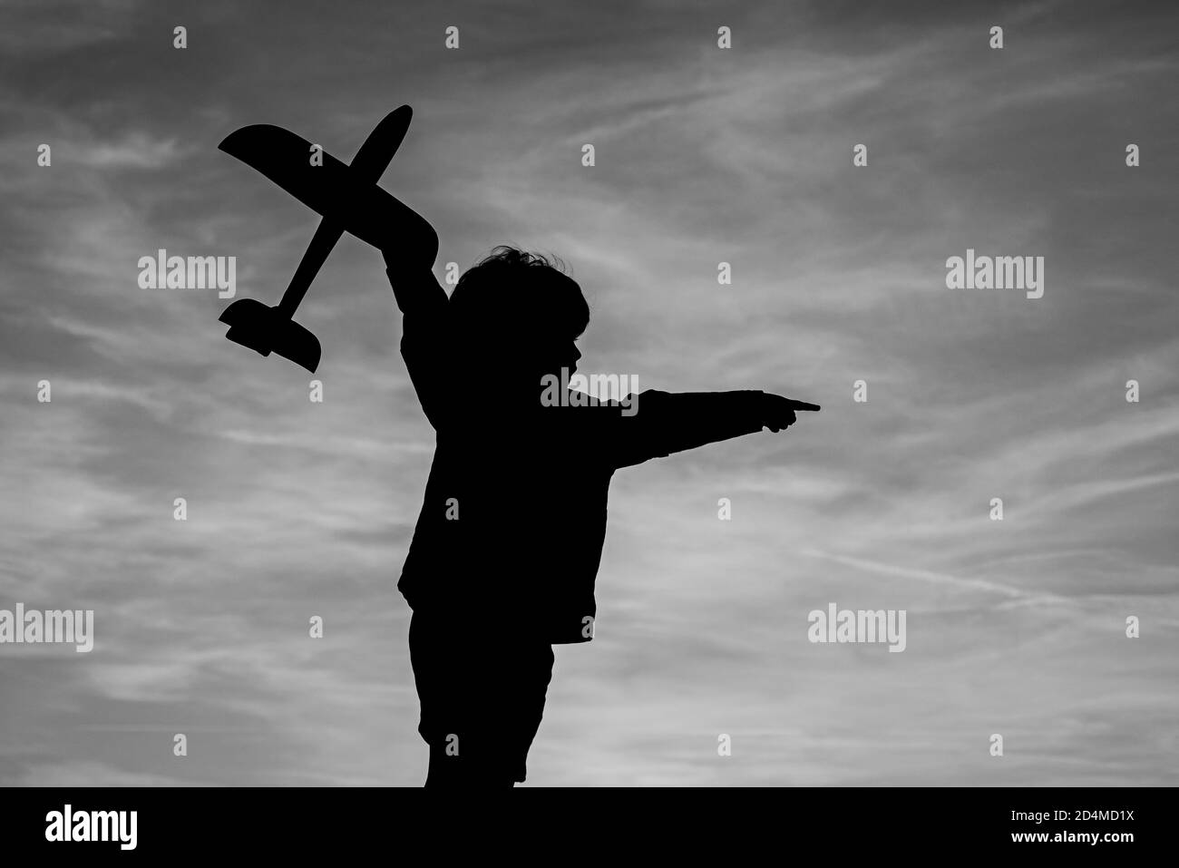 Child playing with toy plane during sunset time in evening. Child ...