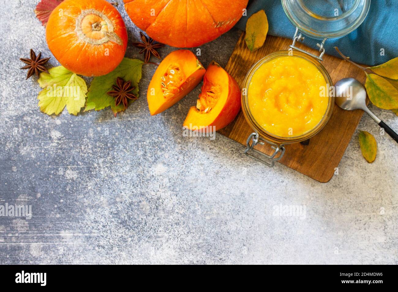 Autumn pumpkin meals for thanksgiving day. Pumpkin Puree on a slate background. Top view flat lay background with copy space. Stock Photo
