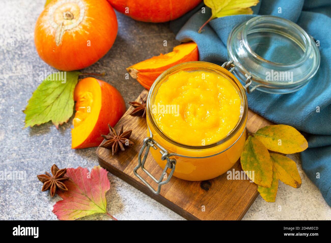 Autumn pumpkin meals for thanksgiving day. Pumpkin Puree on a slate background. Stock Photo