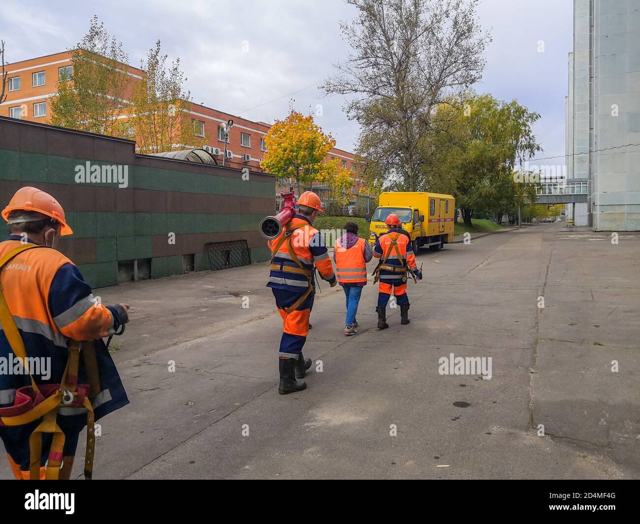 Construction workers in orange uniforms hi-res stock photography and ...