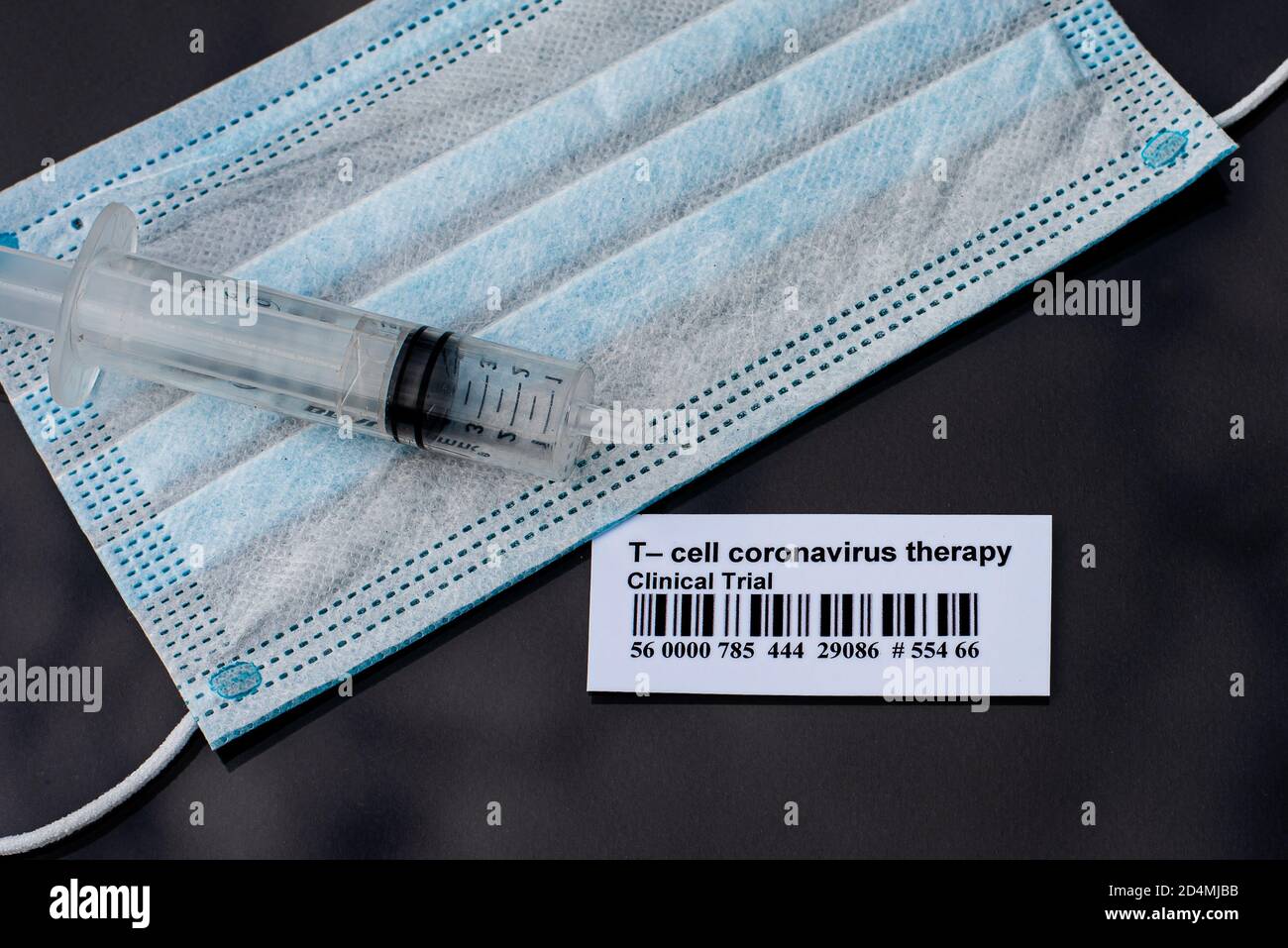 a syringe and face mask for experiment with Tcell coronavirus therapy