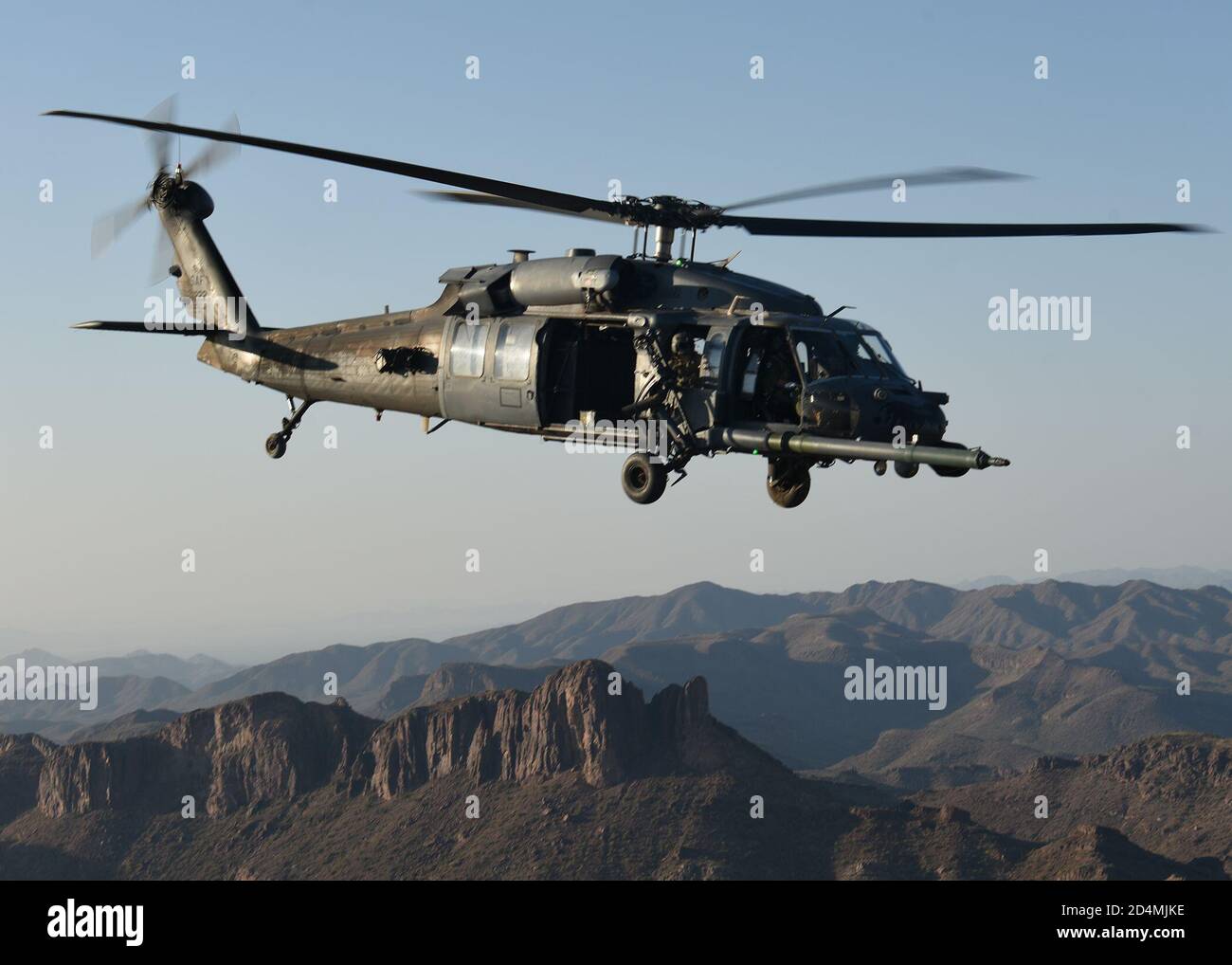 U.S. Air Force Airmen assigned to the 55th Rescue Squadron fly on an HH ...
