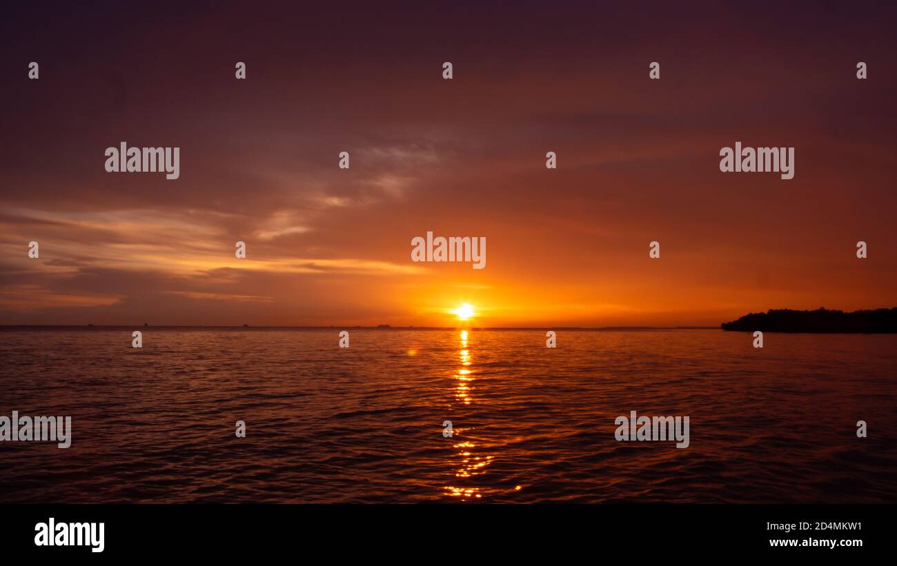 Sunset at the beach Stock Photo - Alamy
