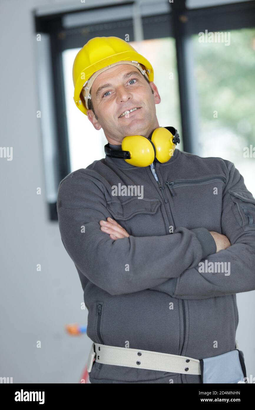 Happy builder crossed arms hi-res stock photography and images - Alamy