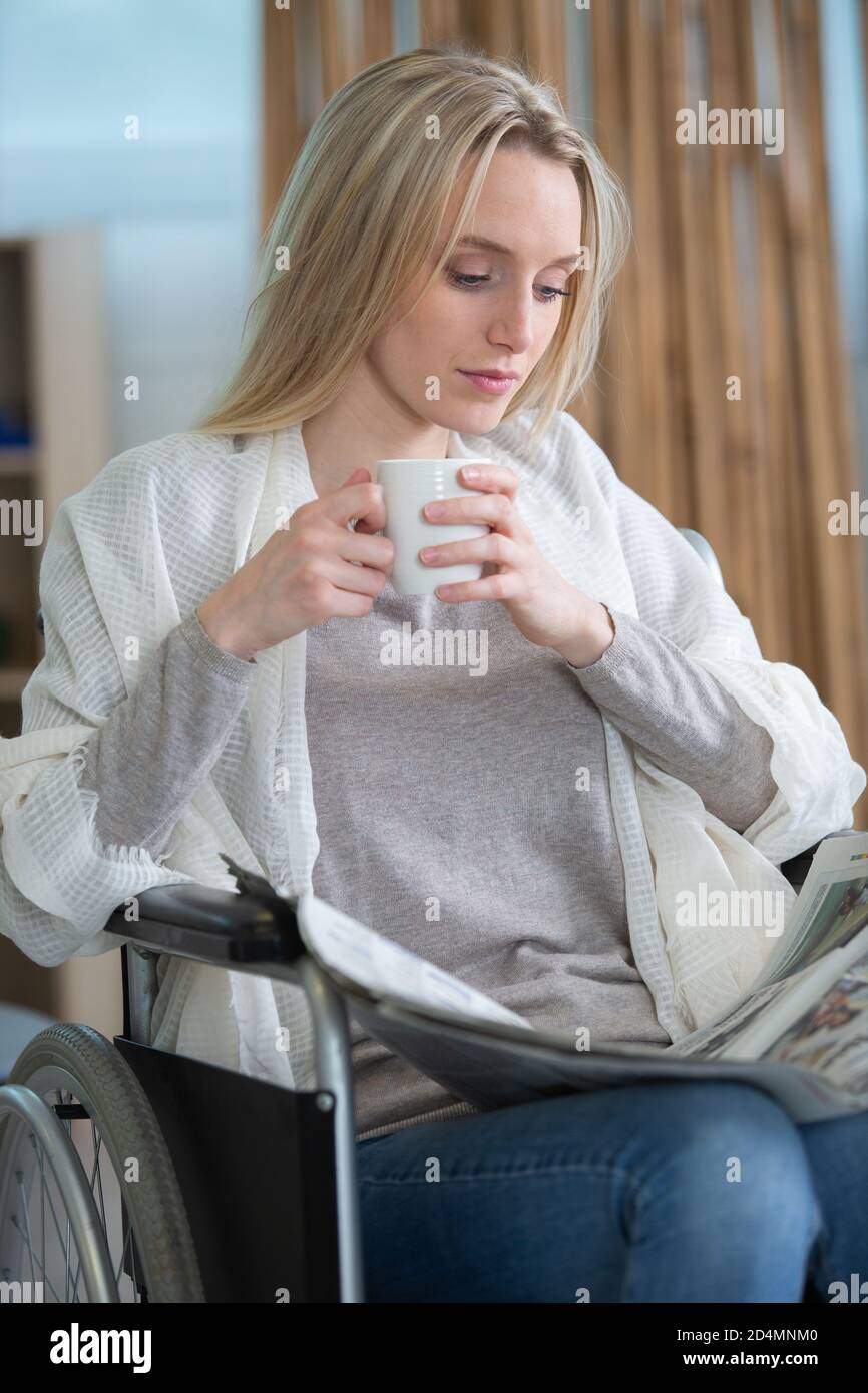 beautiful young disabled woman in wheelchair at home Stock Photo - Alamy