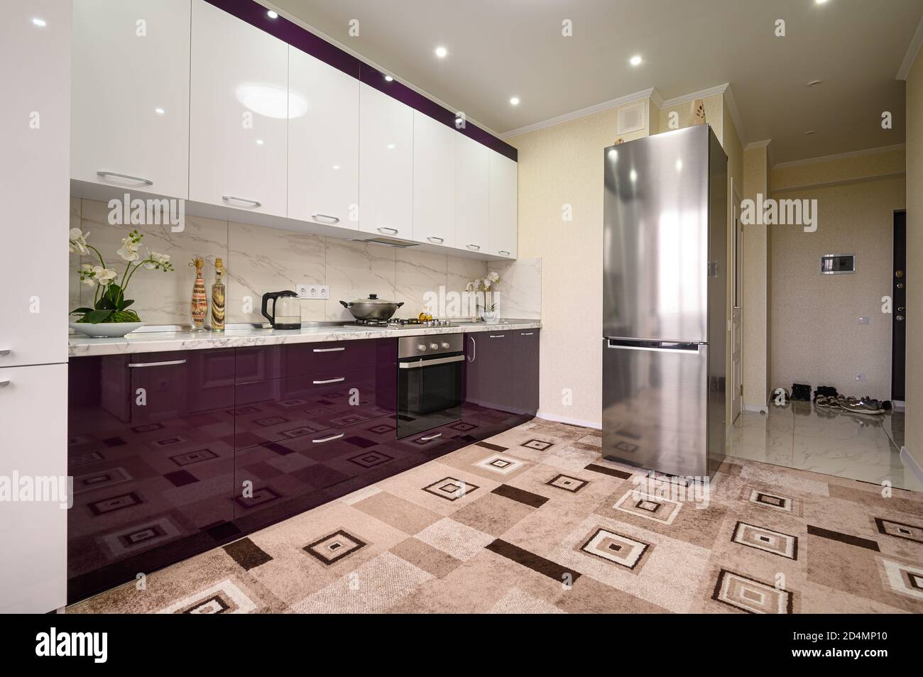 Purple and white modern kitchen furniture, front view Stock Photo - Alamy