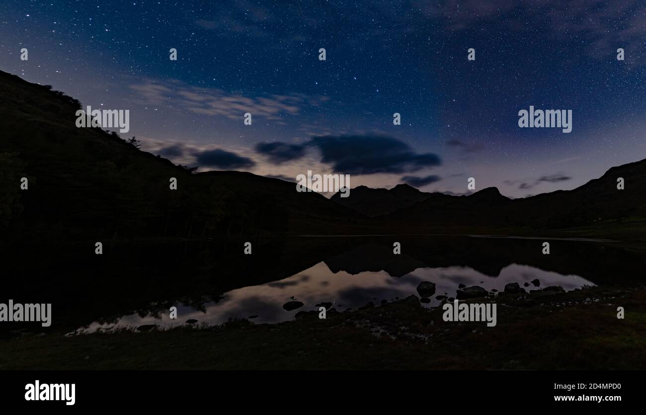 A Panoramic night view of the Plough over Blea Tarn in the English Lake district Stock Photo