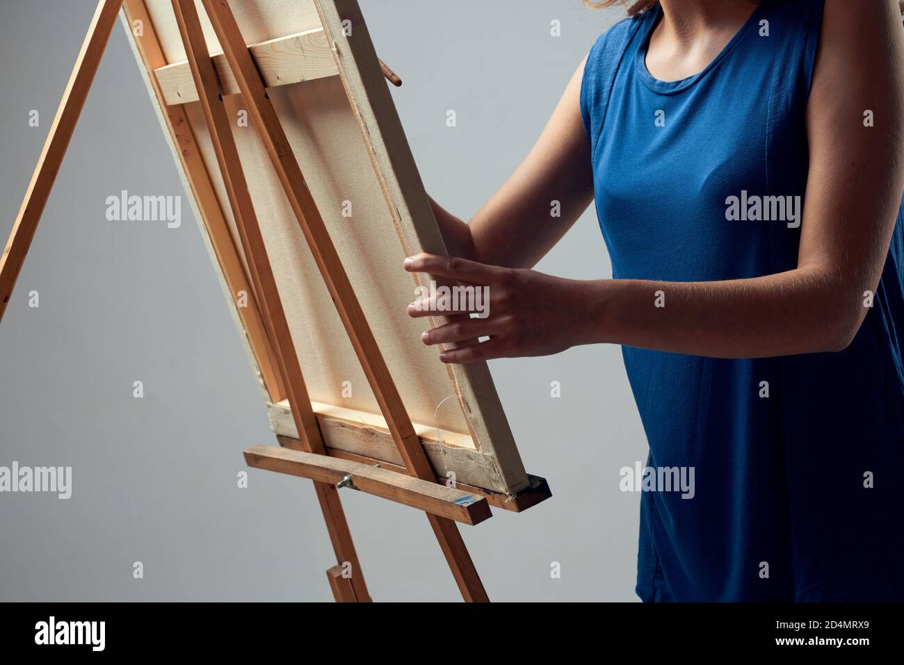 Woman artist with brush paint on easel art hobby light background Stock ...