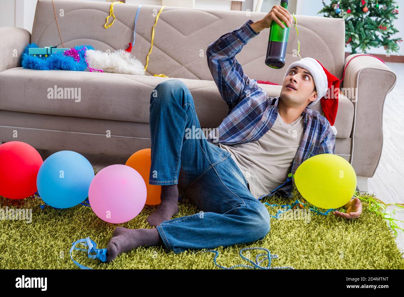 The man having hangover after christmas party Stock Photo Alamy