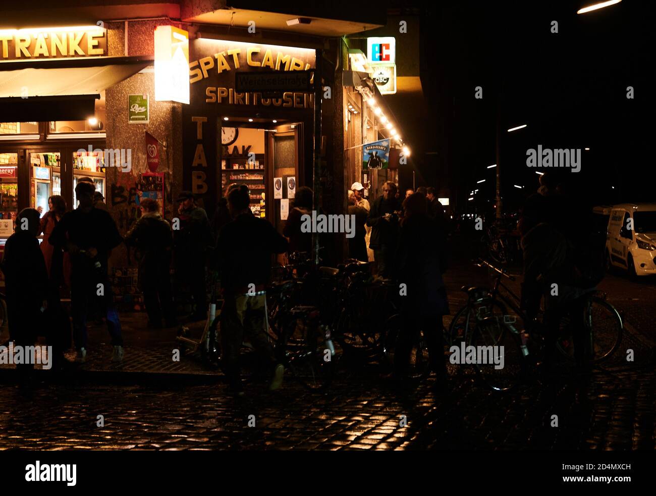 Berlin, Germany. 09th Oct, 2020. Shortly after curfew, guests are still standing in front of a late night party in Neukölln. Closing time and stricter contact bans for indoors and outdoors. Most shops as well as all restaurants and bars must close from 23.00 to 06.00 hours. Outdoors, only five people or people from two households may gather from 23.00 to 06.00 hrs. Credit: Annette Riedl/dpa/Alamy Live News Stock Photo