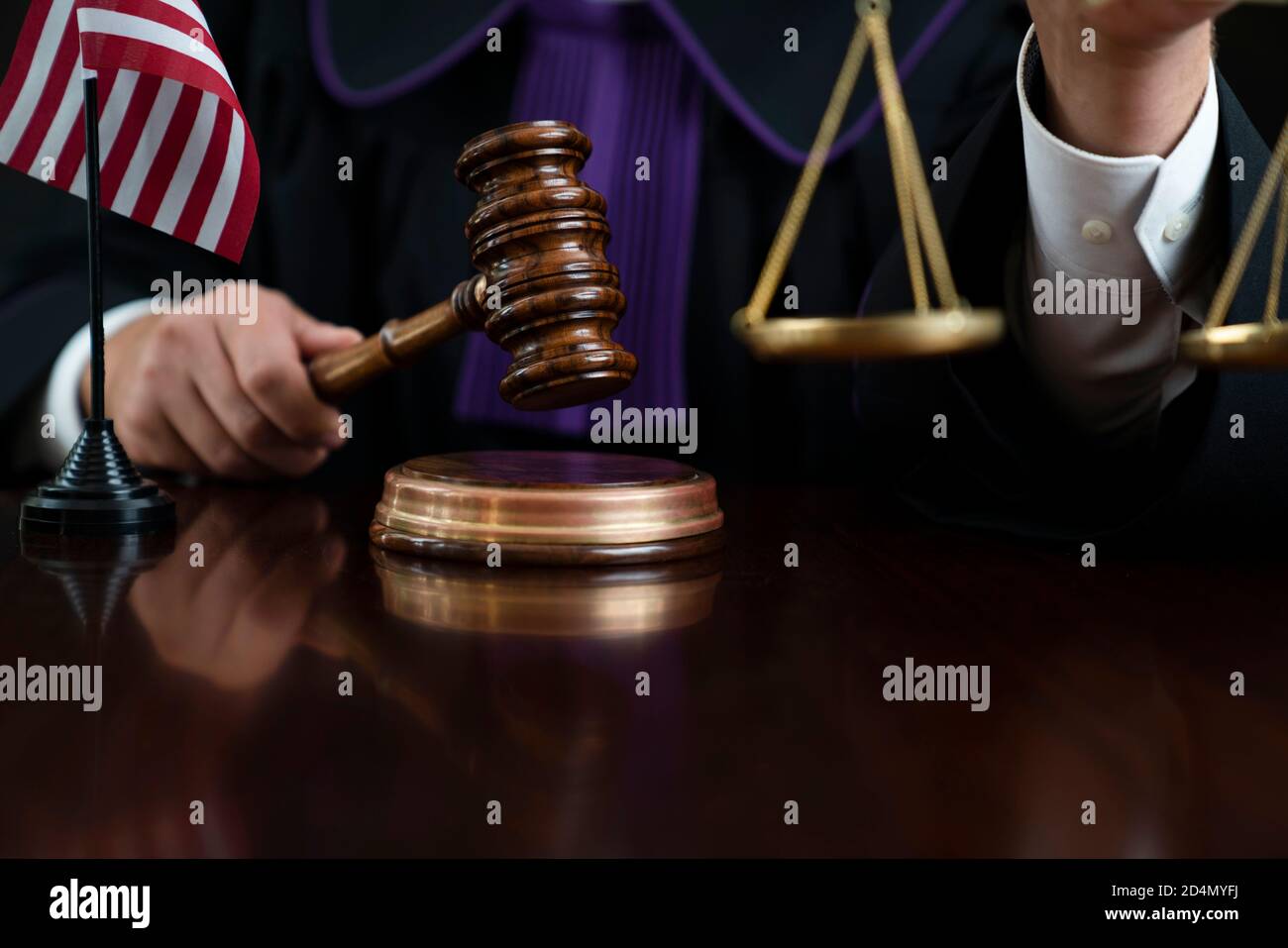 American judge in the courtroom. Gavel, penal code and scale on the