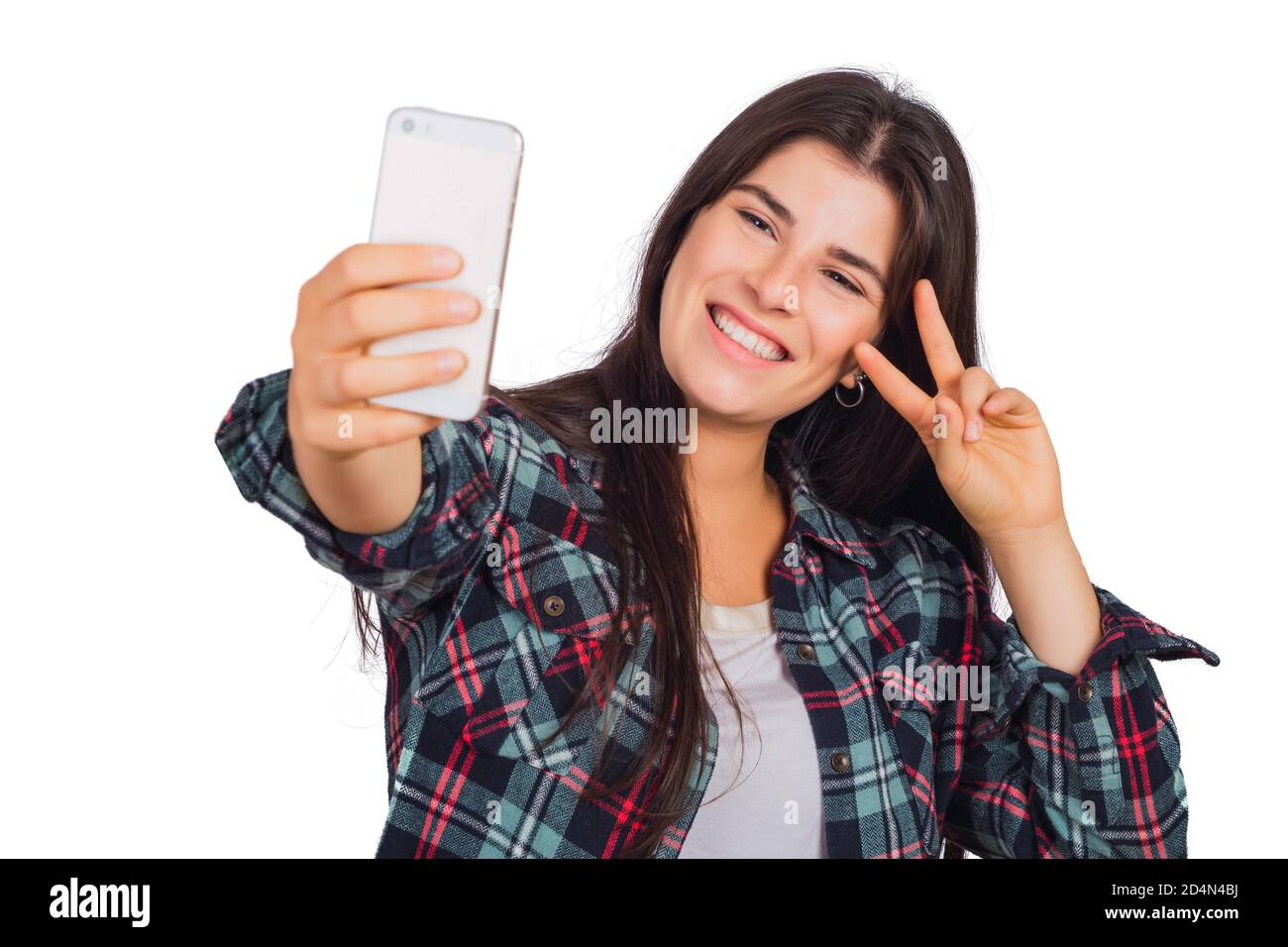 Portrait of young beautiful woman taking a selfie with her mobile phone ...