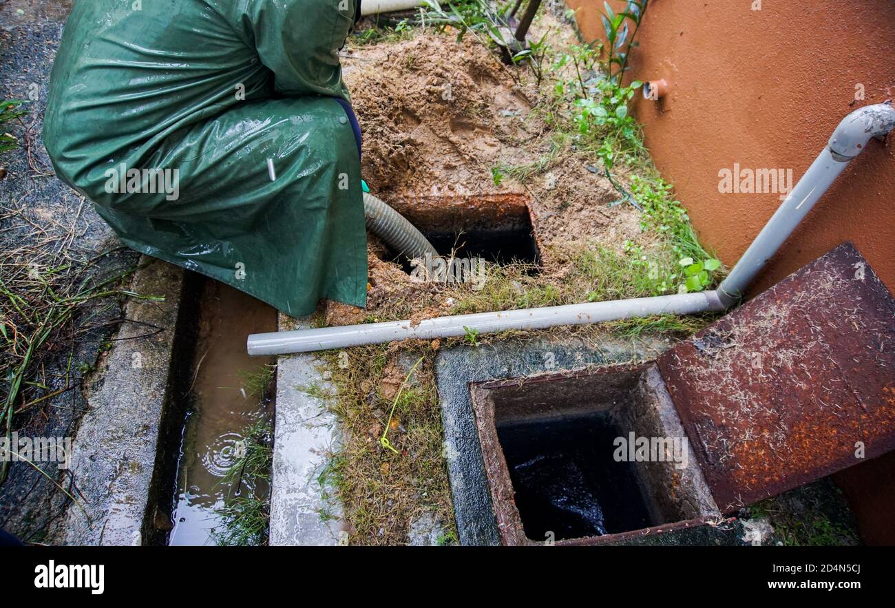 Emptying household septic tank. Cleaning and unblocking clogged drain