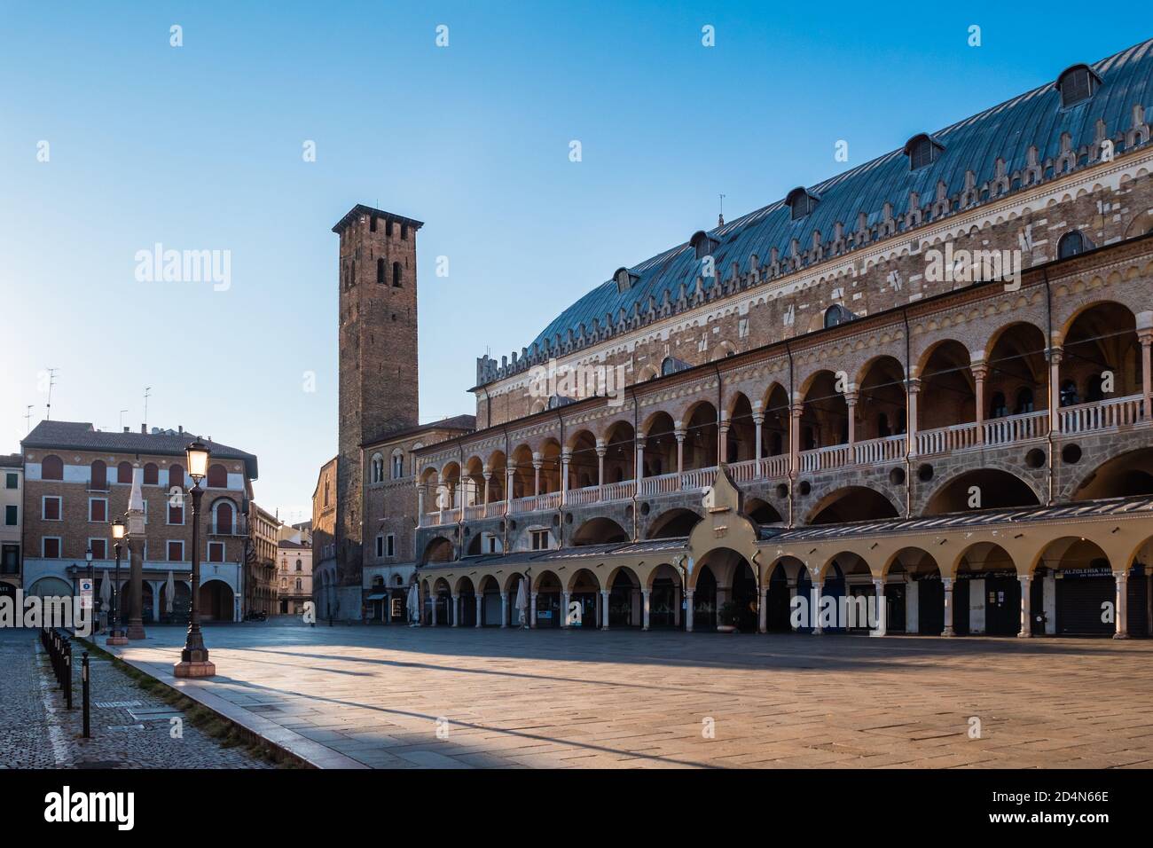 Padua, Italy - August 16 2020: Palazzo della Ragione Palace on Piazza della Frutta Square  with Torre degli Anziani Stock Photo