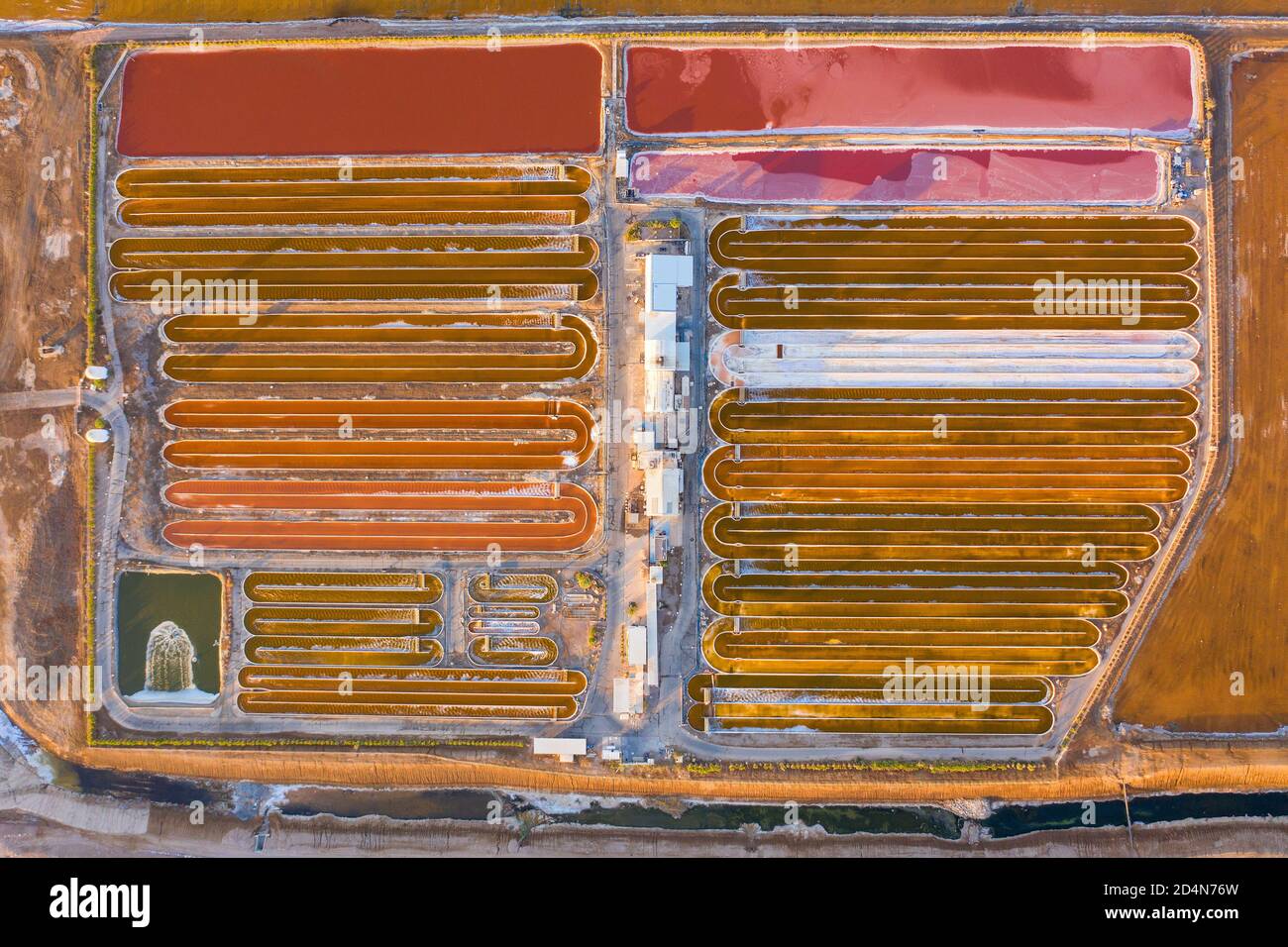 Salt cultivation evaporation pools for domestic market, Aerial view. Stock Photo