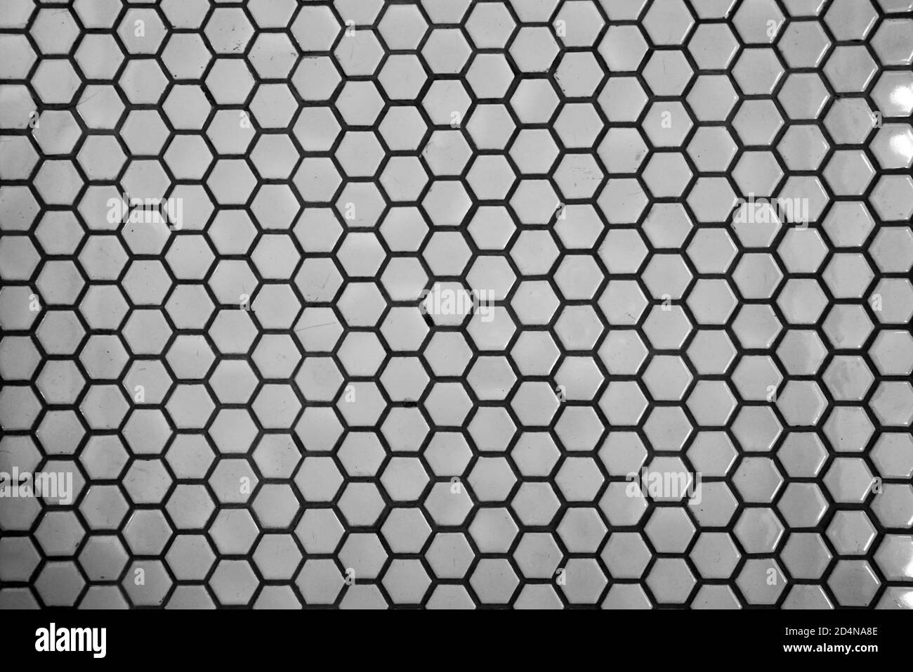 Close up texture and surface of Hexagonal white mosaic floor and wall tiles Stock Photo