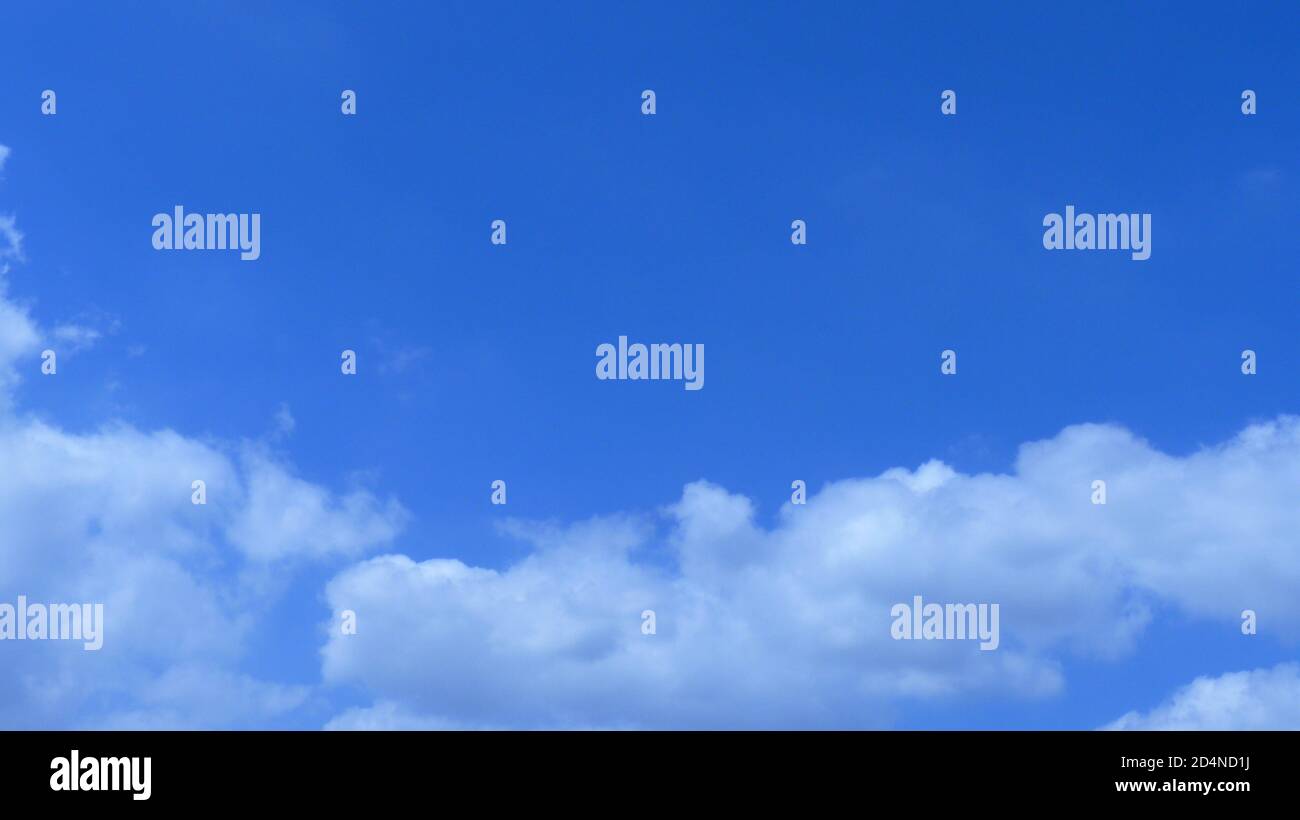 Beautiful fluffy clouds in the blue sky - great for wallpapers Stock ...