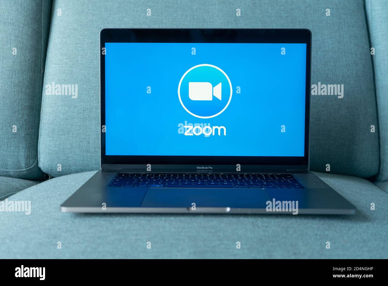 Laptop showing Zoom Cloud Meetings app logo. Work and have meetings