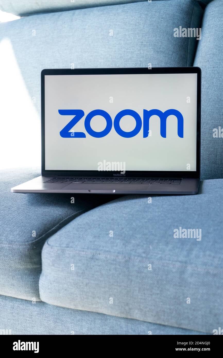 Laptop showing Zoom Cloud Meetings app logo. Work and have meetings from home. Stock Photo