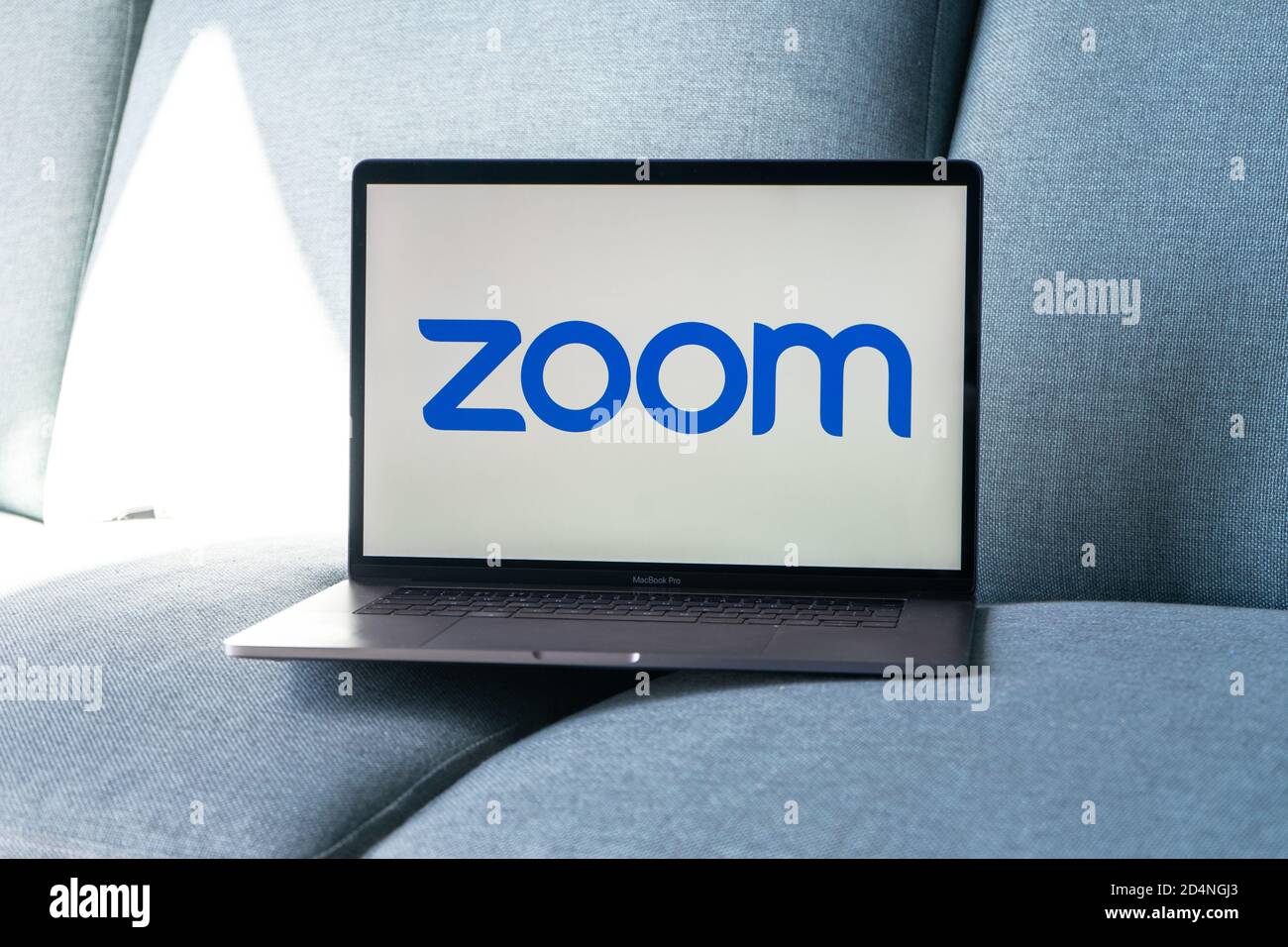 Laptop showing Zoom Cloud Meetings app logo. Work and have meetings