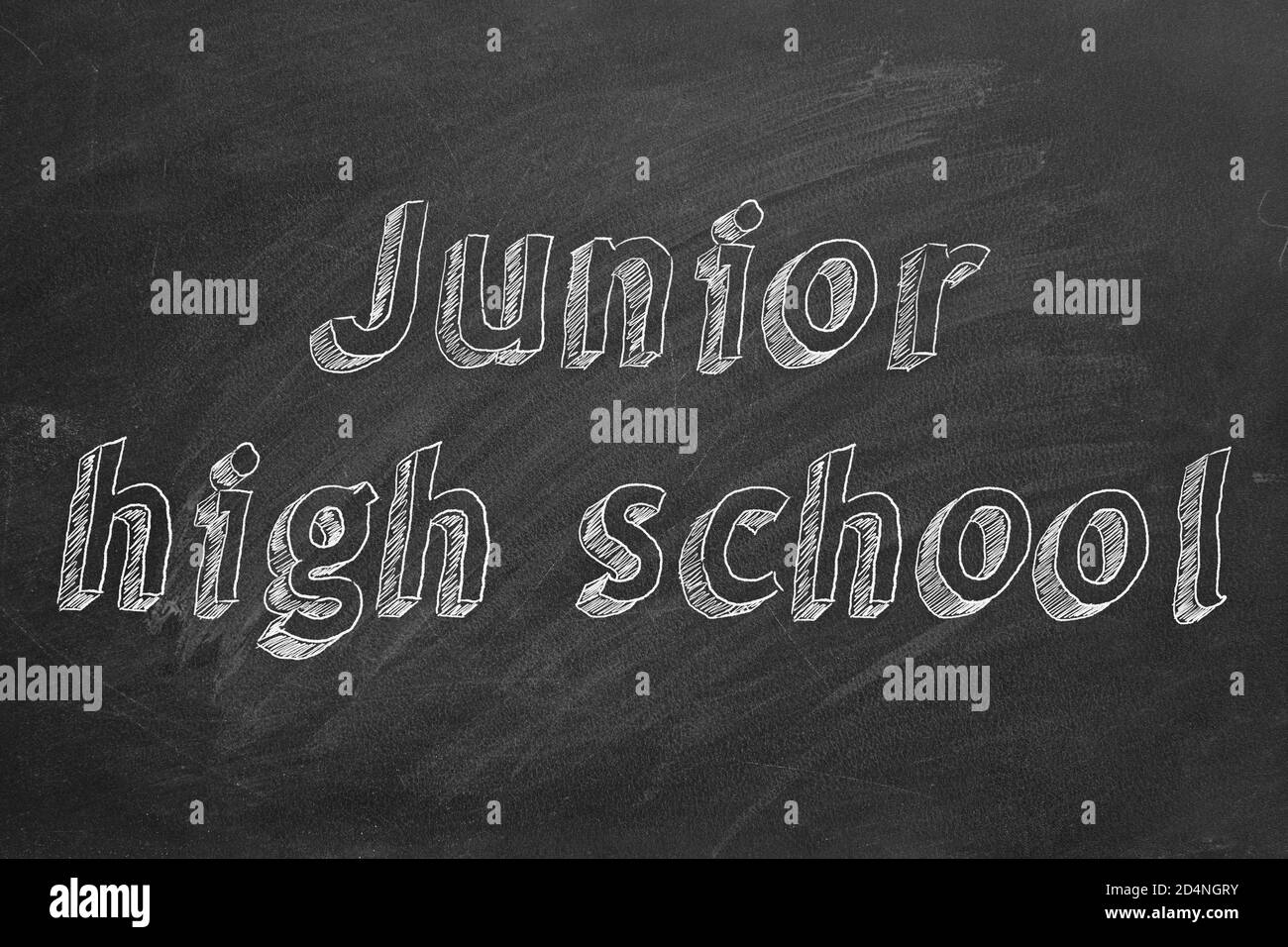 Hand drawing 'Junior high school' on black chalkboard Stock Photo