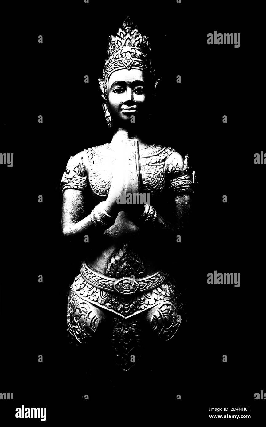 An ancient stone statue of a Buddhist woman from Cambodia. Stock Photo