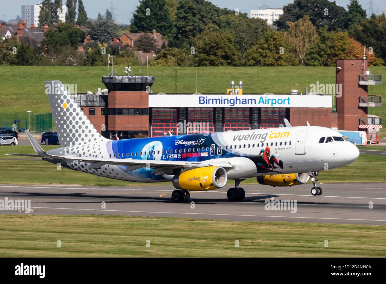 Vueling Airlines Airbus EC-MYC an Airbus A320-232/S,  Disneyland Livery takes of  from Birmingham Airport Stock Photo
