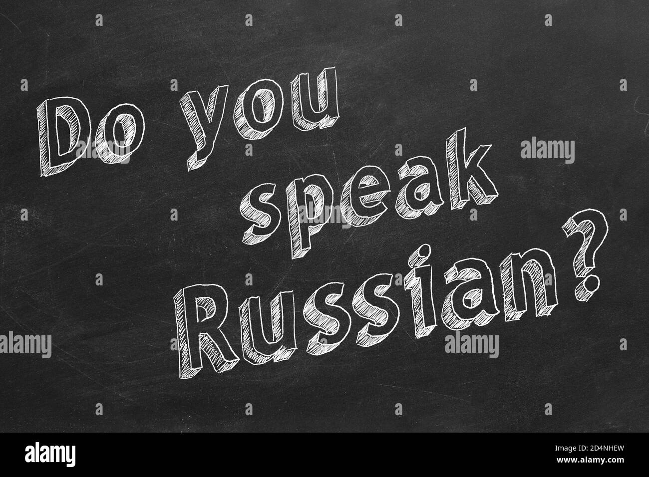 Hand drawing "Do you speak Russian?" on blackboard. Stock Photo