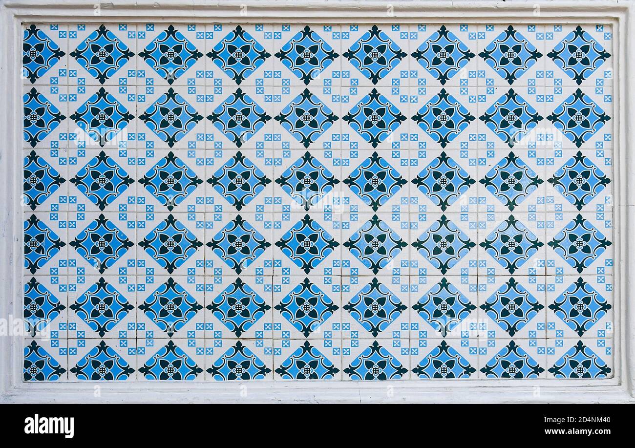 A geometric ceramic tile mosaic as typically found on the frontages of traditional chinese peranakan shop houses in Asia Stock Photo